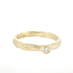 Textured yellow gold ring with diamond